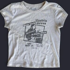 Tan John Galt baby tee with vintage electric circus print